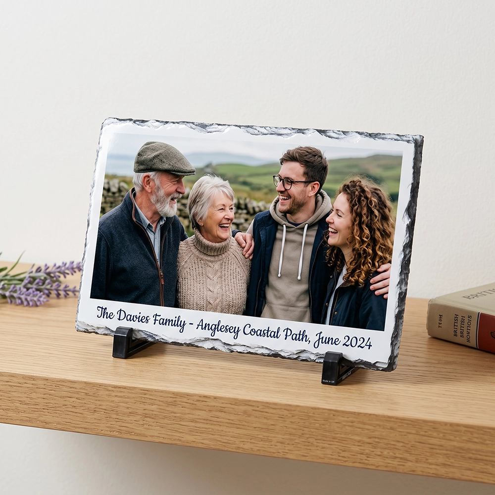 Personalised glass photo frame displayed with a family photo and printed message.